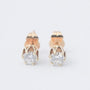 Gold solitaire earrings with a brilliant in each one