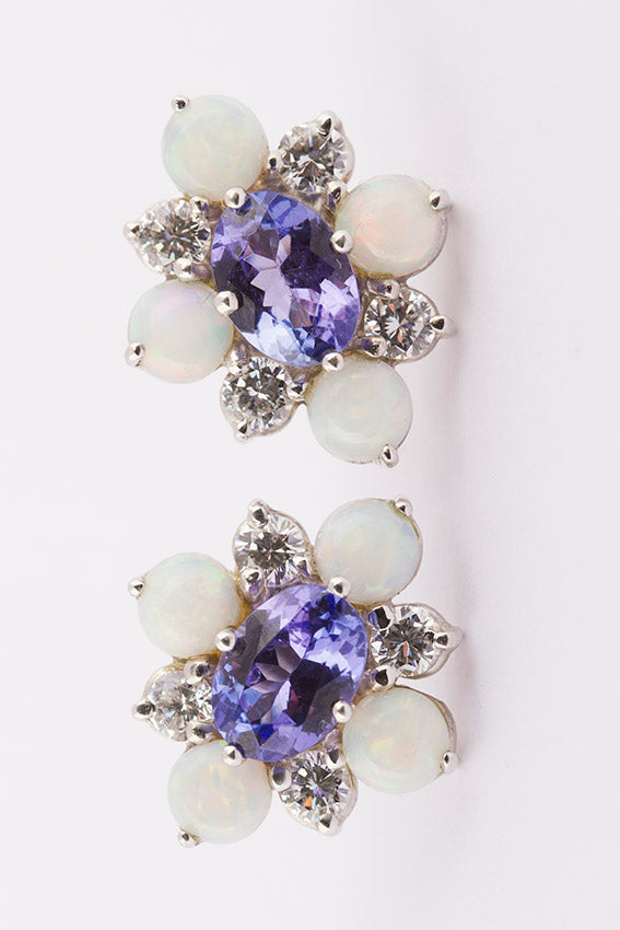 White gold studs with tanzanite, opal and brilliant