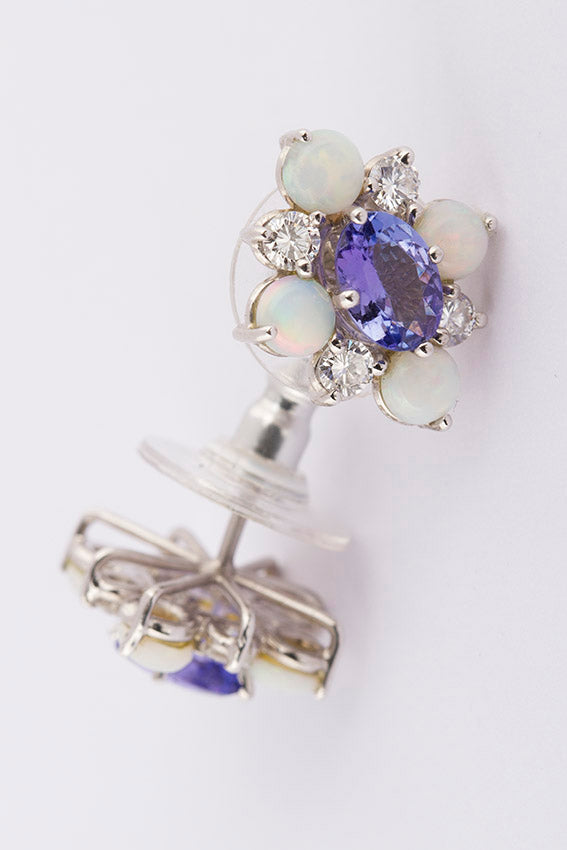 White gold studs with tanzanite, opal and brilliant