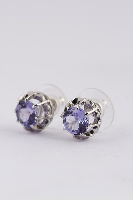 Platinum solitaire stud earrings (bwg) with a tanzanite in each one