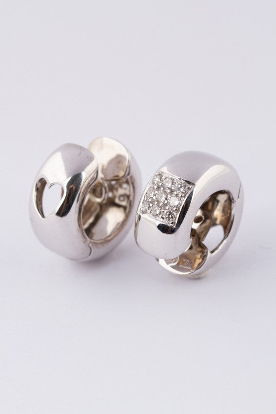 white gold earrings with 9 diamonds each