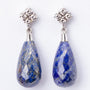 White gold earrings, each with a lapis lazuli and diamonds