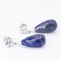White gold earrings, each with a lapis lazuli and diamonds