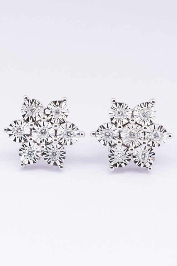 White gold star earrings with diamonds