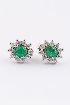 White gold entourage earrings with emerald and diamonds