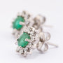 White gold entourage earrings with emerald and diamonds