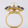 Gold ring with pearl and enamel