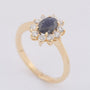 Yellow gold entourage ring with sapphire and brilliant-cut diamonds