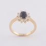 Yellow gold entourage ring with sapphire and brilliant-cut diamonds
