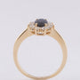 Yellow gold entourage ring with sapphire and brilliant-cut diamonds