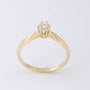 Gold solitaire ring with a brilliant
