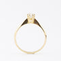 Gold solitaire ring with a brilliant