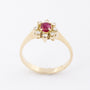 Gold entourage ring with ruby ​​and diamonds