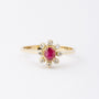 Gold entourage ring with ruby ​​and diamonds