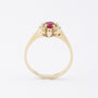 Gold entourage ring with ruby ​​and diamonds