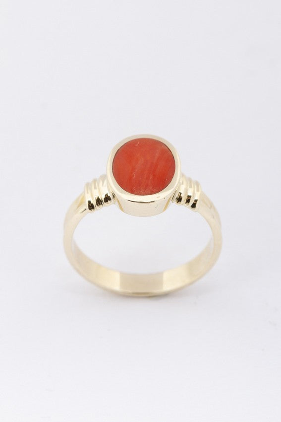 Gold ring with blood coral