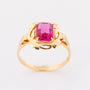 Gold ring with red crystal