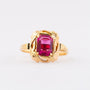 Gold ring with red crystal