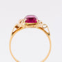 Gold ring with red crystal