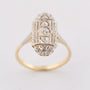 Wit/geel gouden Art Deco ring met een briljant van ca. 0.035 ct.
