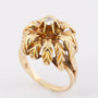 Gold flower ring with a brilliant