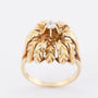Gold flower ring with a brilliant