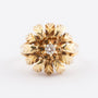 Gold flower ring with a brilliant