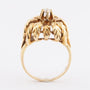 Gold flower ring with a brilliant