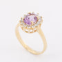 Gold entourage ring with amethyst and diamonds
