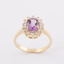 Gold entourage ring with amethyst and diamonds