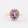 Gold entourage ring with amethyst and diamonds