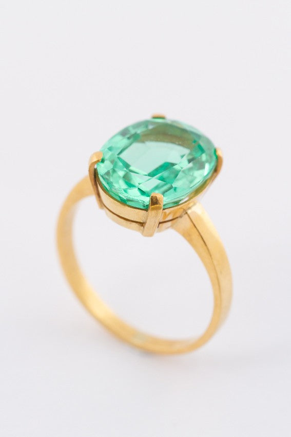 Gold ring with green synthetic corundum