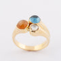 Gold ring with 3 gemstones including a rose-cut diamond, topaz and chalcedony