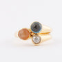 Gold ring with 3 gemstones including a rose-cut diamond, topaz and chalcedony