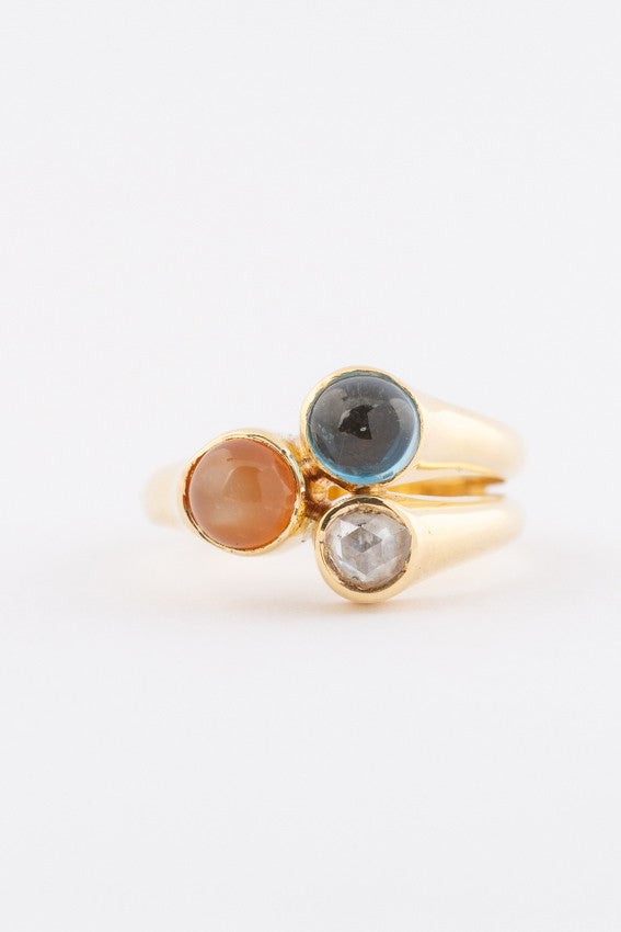 Gold ring with 3 gemstones including a rose-cut diamond, topaz and chalcedony