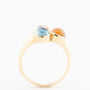 Gold ring with 3 gemstones including a rose-cut diamond, topaz and chalcedony