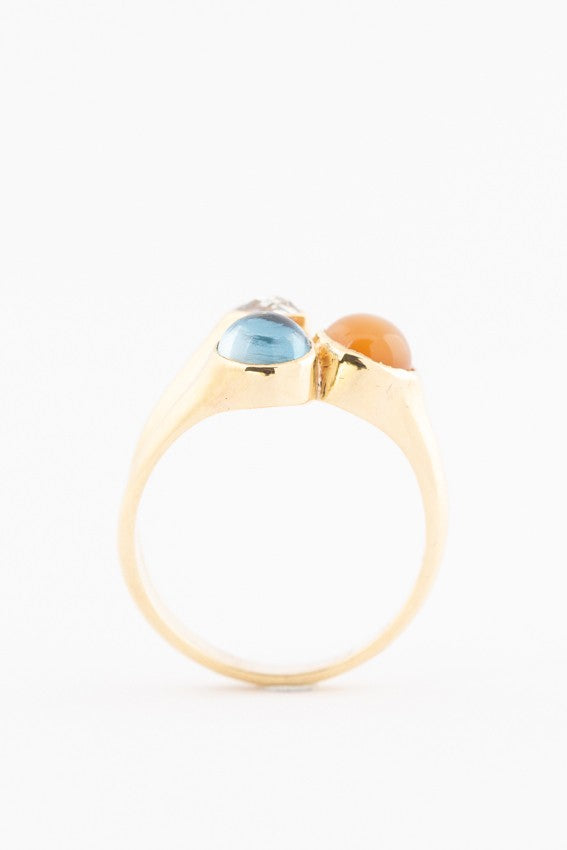 Gold ring with 3 gemstones including a rose-cut diamond, topaz and chalcedony