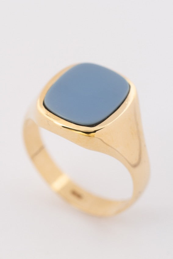 Gold ring with blue layered stone