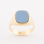 Gold ring with blue layered stone
