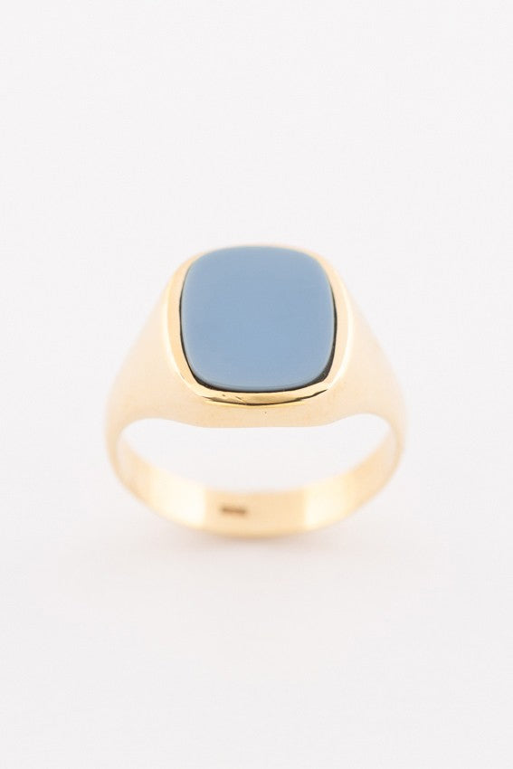 Gold ring with blue layered stone
