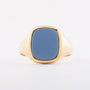 Gold ring with blue layered stone