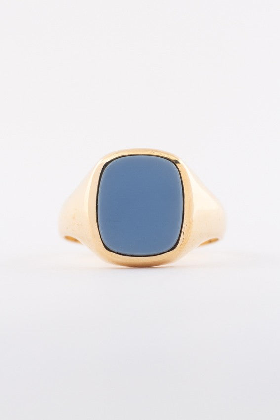 Gold ring with blue layered stone