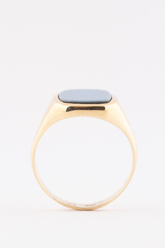 Gold ring with blue layered stone