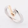 Solid white/rose gold ring with a 0.17 ct brilliant.
