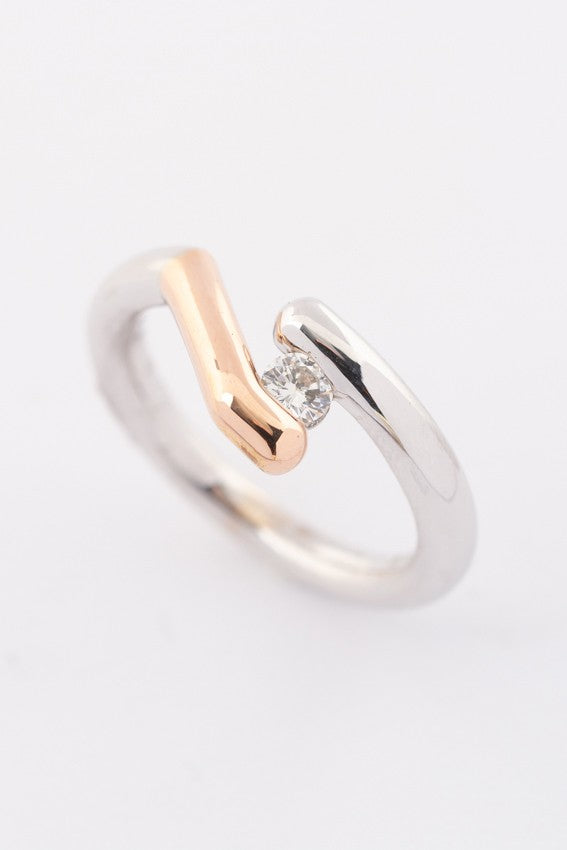 Solid white/rose gold ring with a 0.17 ct brilliant.