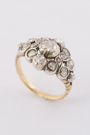 Gold entourage ring with rose-cut diamonds set in silver