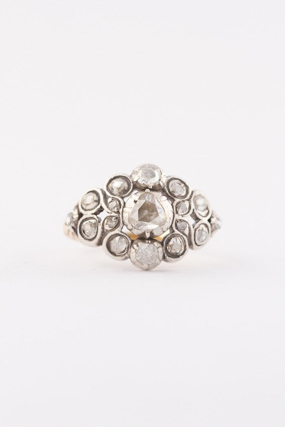 Gold entourage ring with rose-cut diamonds set in silver
