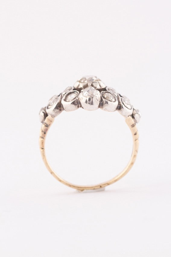 Gold entourage ring with rose-cut diamonds set in silver