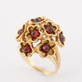 Gold cocktail ring with garnets