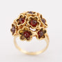 Gold cocktail ring with garnets